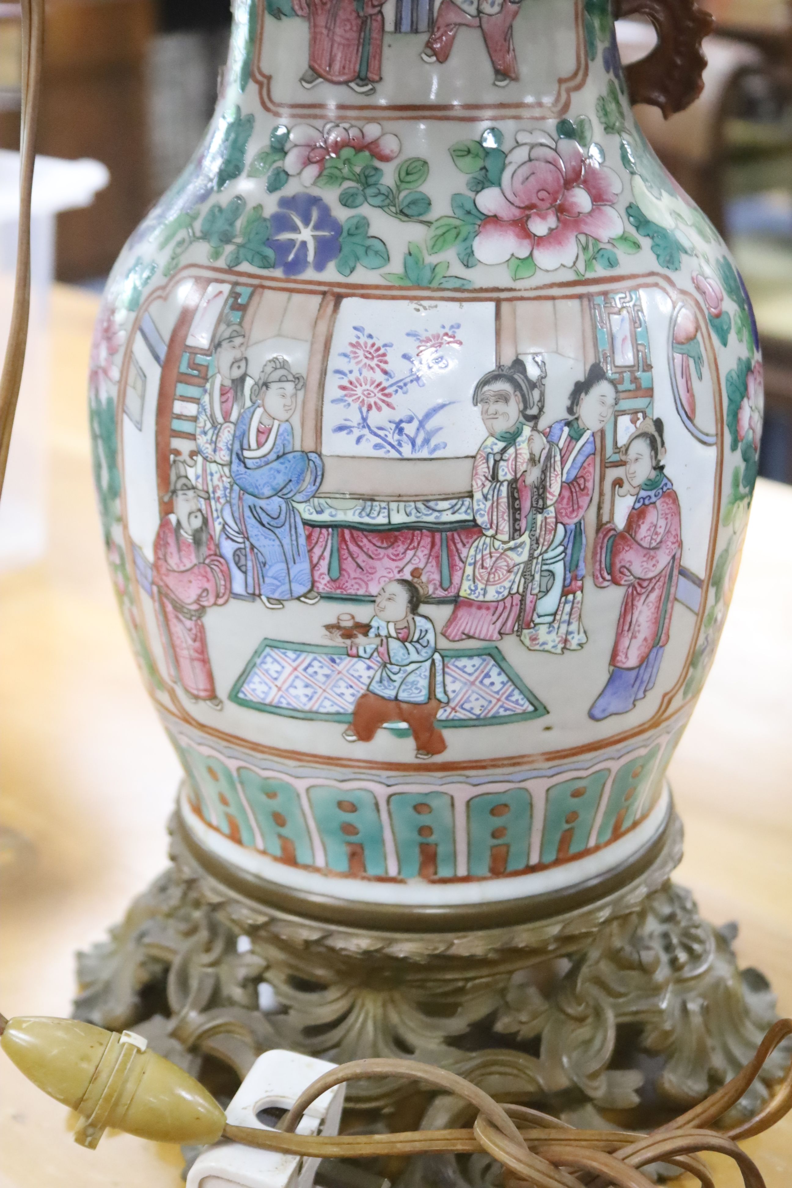 A late 19th century Cantonese famille rose baluster vase (lacking one handle), ormolu mounted and fitted as a table lamp, height 40cm e